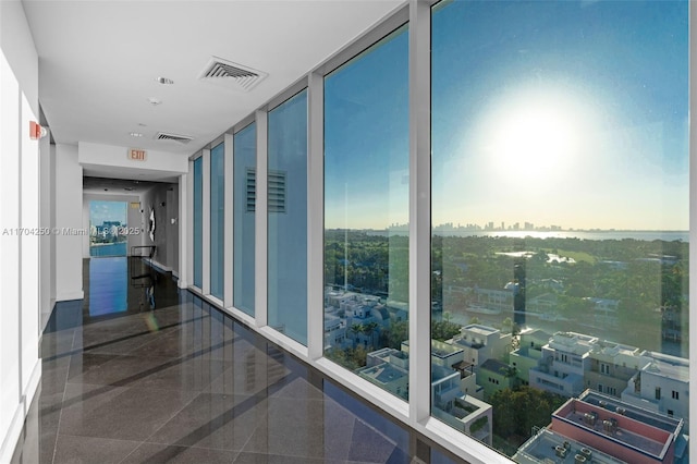 hallway featuring floor to ceiling windows