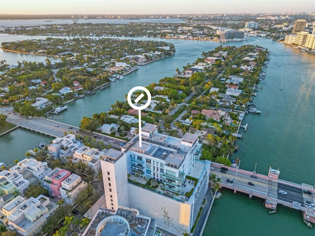 aerial view at dusk with a water view