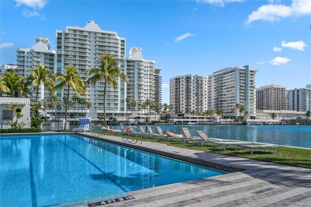 view of pool with a water view