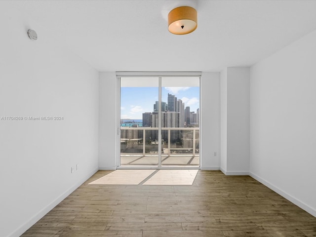 spare room featuring hardwood / wood-style flooring