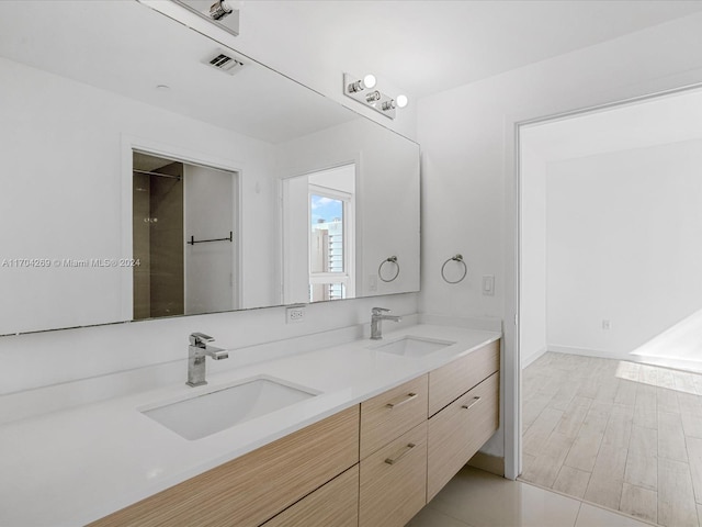 bathroom featuring hardwood / wood-style floors and vanity