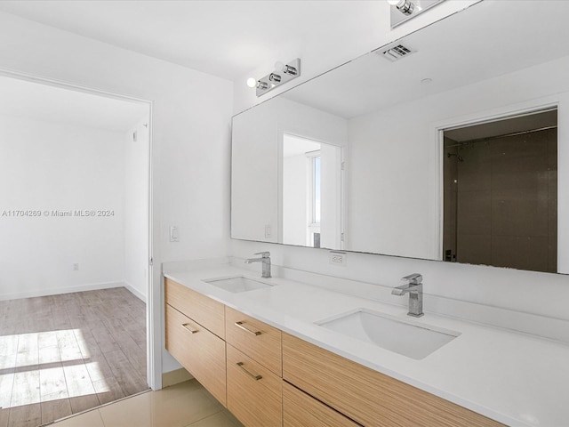 bathroom featuring hardwood / wood-style floors and vanity