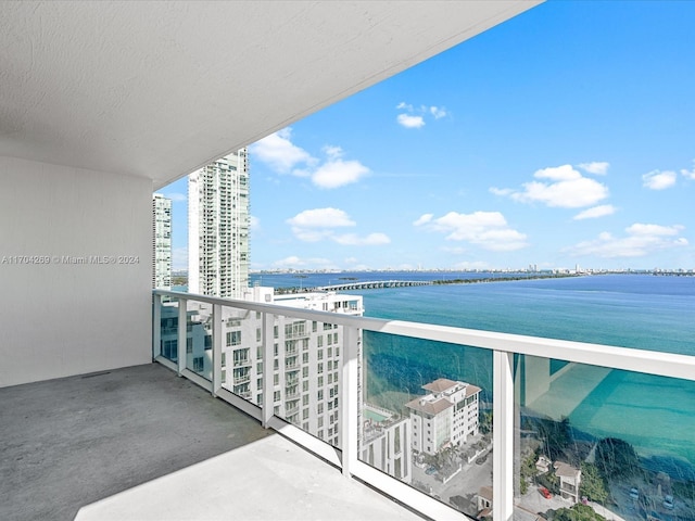 balcony featuring a water view