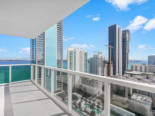 balcony featuring a water view