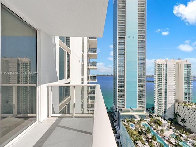 balcony featuring a water view