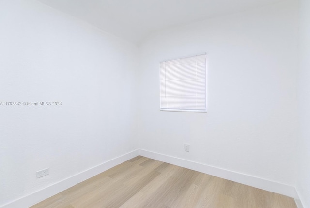 spare room with light hardwood / wood-style floors