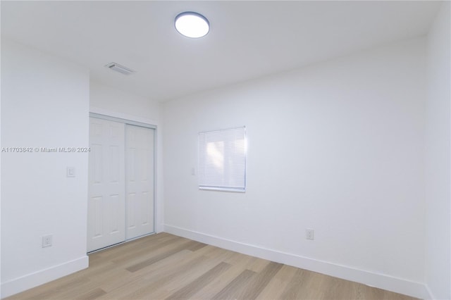 unfurnished room featuring light hardwood / wood-style flooring