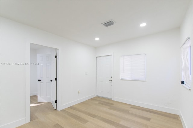 unfurnished room featuring light wood-type flooring