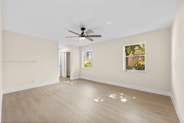 spare room featuring ceiling fan and light hardwood / wood-style floors