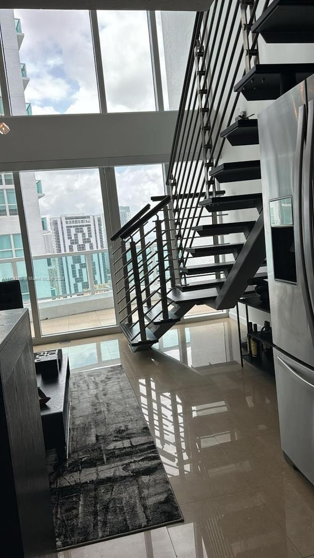 41 SE 5th St Unit 2011, Miami, FL 33131 - staircase featuring tile patterned flooring