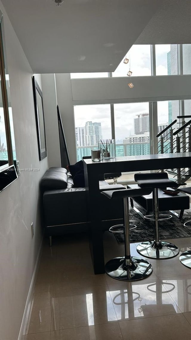 41 SE 5th St Unit 2011, Miami, FL 33131 - tiled dining space with a view of city and baseboards
