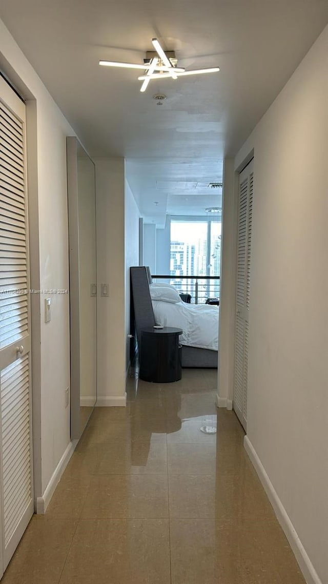 41 SE 5th St Unit 2011, Miami, FL 33131 - hall featuring baseboards and tile patterned flooring