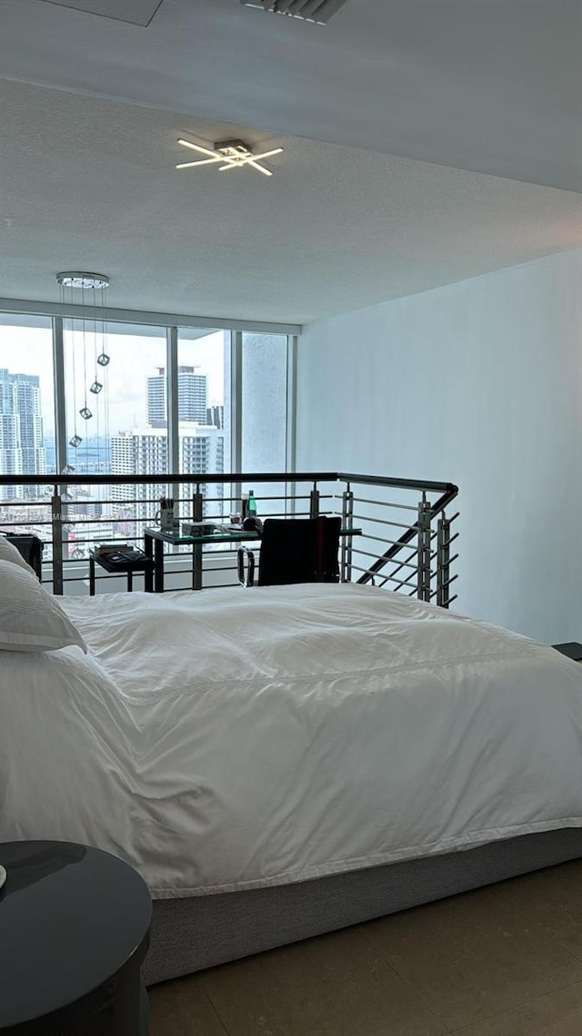 41 SE 5th St Unit 2011, Miami, FL 33131 - bedroom featuring a view of city, multiple windows, and a wall of windows