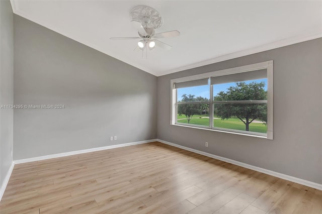 empty room with ceiling fan, crown molding, and light hardwood / wood-style flooring