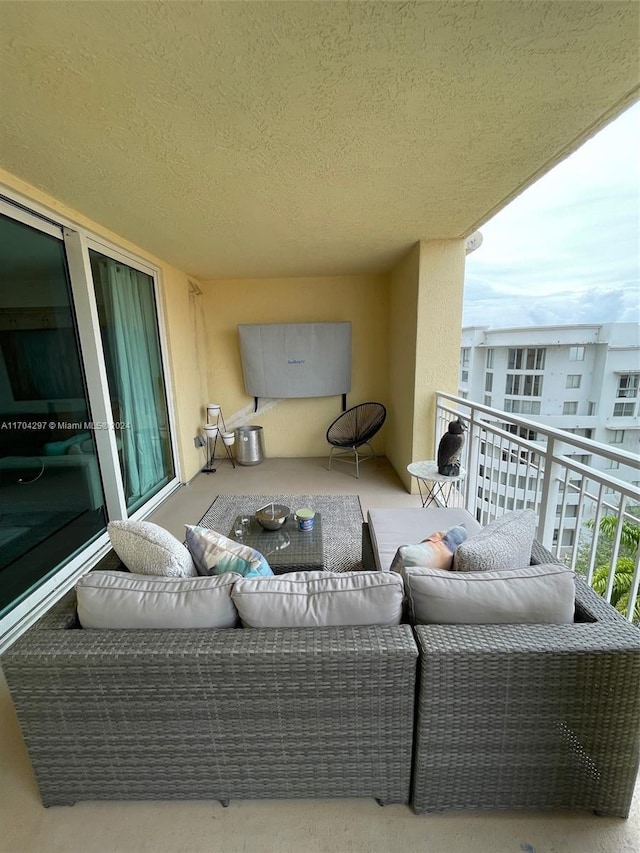 balcony with an outdoor hangout area