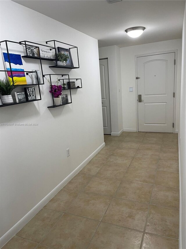 7350 SW 89th St Unit 817S, Miami, FL 33156 - hall featuring tile patterned floors and baseboards