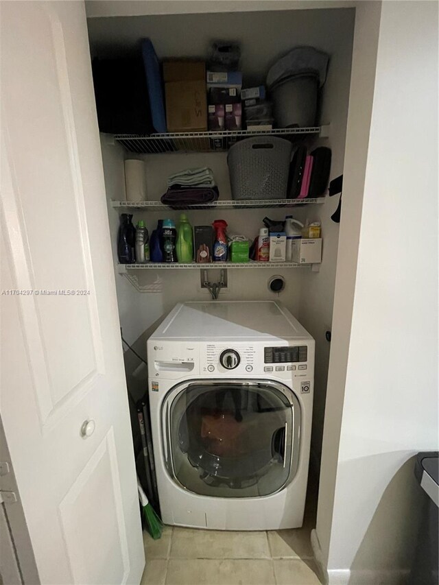 7350 SW 89th St Unit 817S, Miami, FL 33156 - laundry room featuring washer / clothes dryer and light tile patterned floors