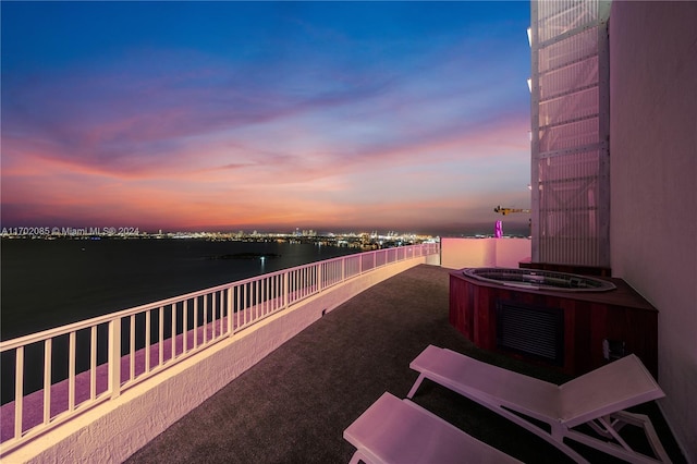 patio terrace at dusk with a water view