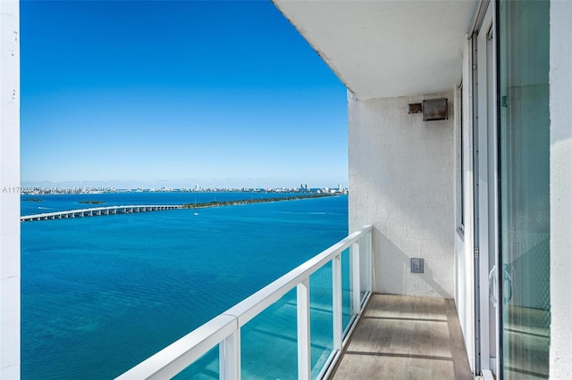 balcony featuring a water view