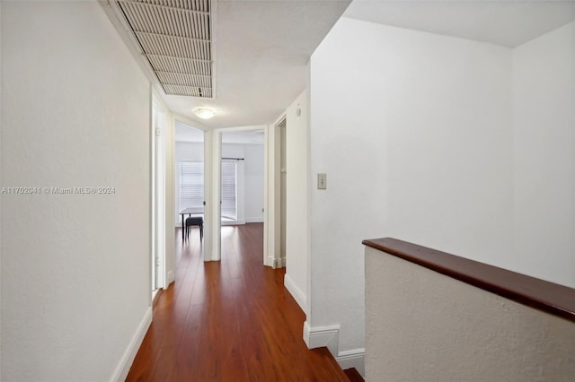 hall featuring dark wood-type flooring