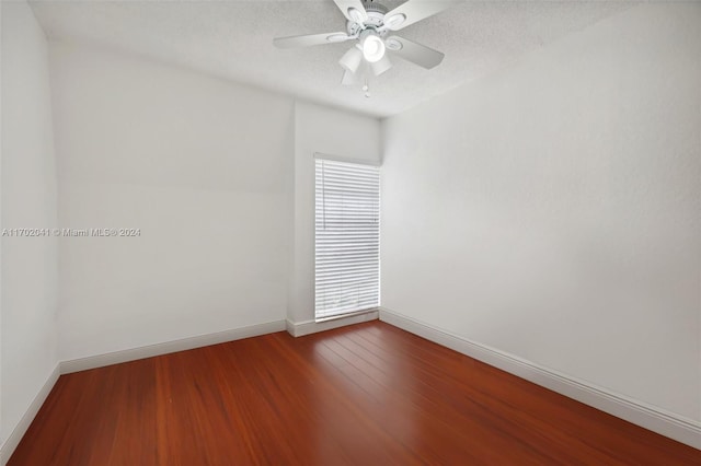 unfurnished room with ceiling fan, hardwood / wood-style floors, and a textured ceiling