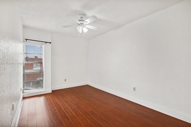 spare room with hardwood / wood-style floors, a textured ceiling, and ceiling fan