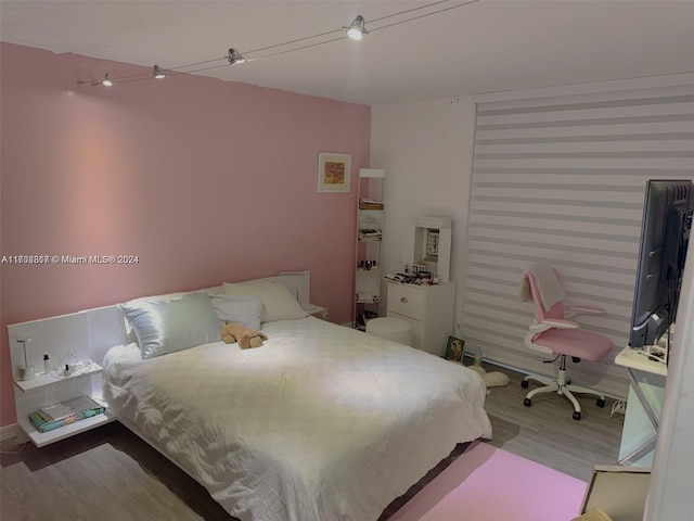 bedroom featuring hardwood / wood-style flooring