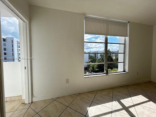 view of tiled spare room