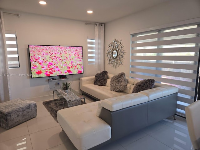 tiled living room featuring a wealth of natural light