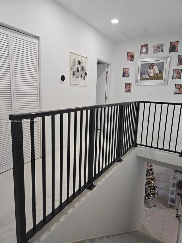 hall featuring light tile patterned flooring