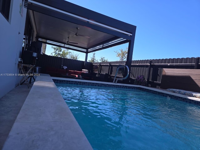 view of swimming pool with ceiling fan