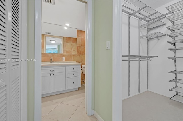 bathroom featuring tile patterned floors and vanity