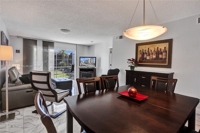 dining room with a textured ceiling