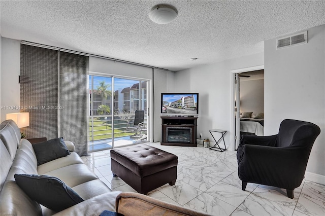 living room with a textured ceiling