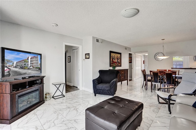 living room featuring a textured ceiling