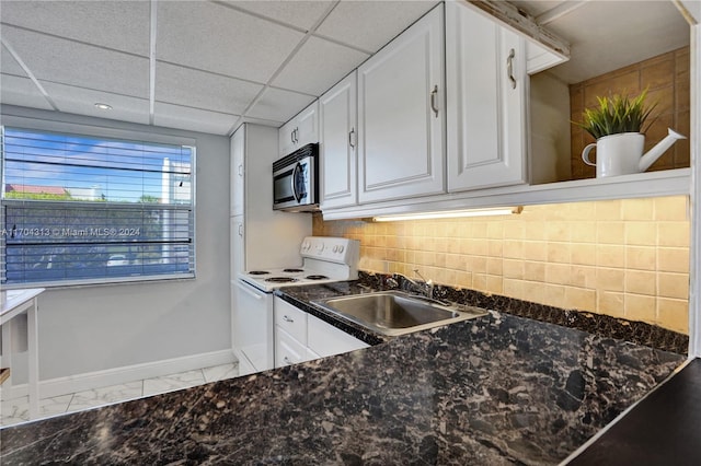 kitchen with white cabinetry, sink, electric range, a drop ceiling, and tasteful backsplash