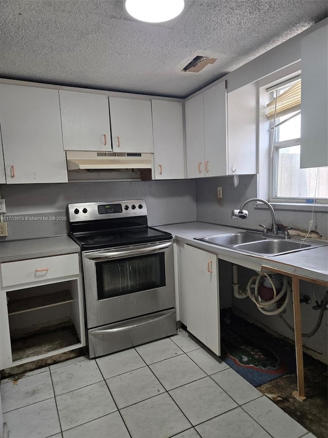 kitchen featuring white cabinetry, stainless steel electric range oven, sink, and a textured ceiling