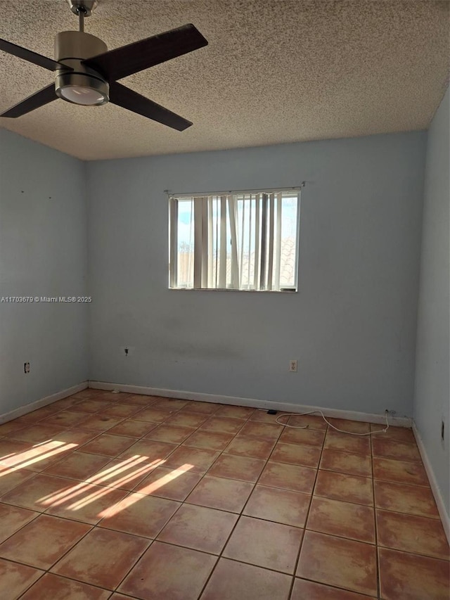 unfurnished room featuring tile patterned flooring, a textured ceiling, and ceiling fan