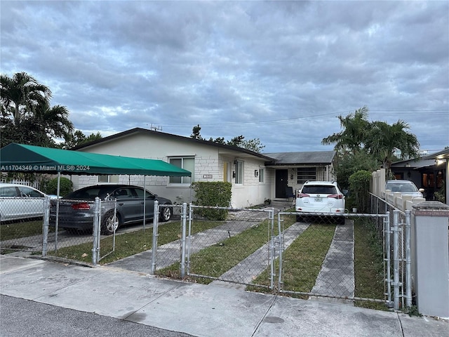 view of front of home with a carport