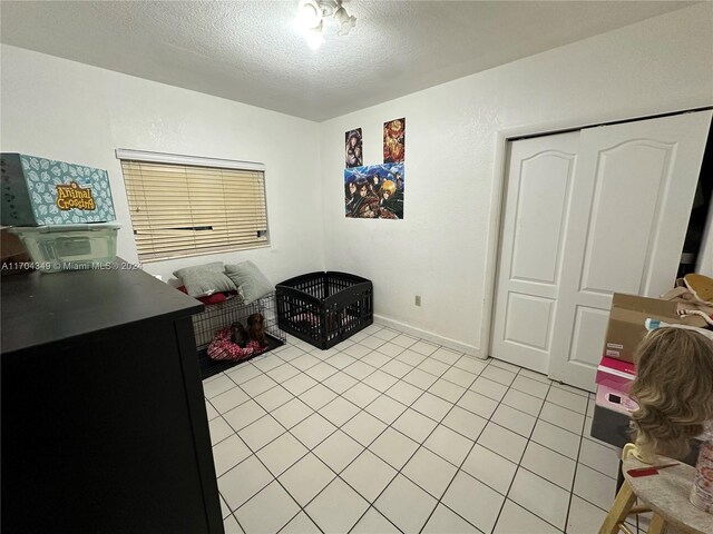 1838 NW 18th St, Miami, FL 33125 - washroom featuring a textured ceiling and light tile patterned flooring