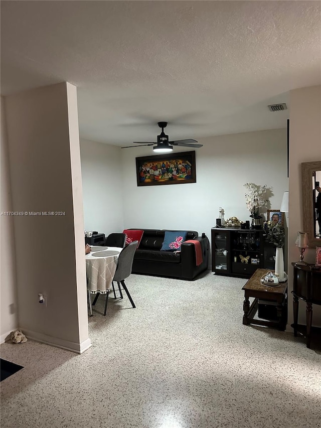 1838 NW 18th St, Miami, FL 33125 - living room featuring ceiling fan and speckled floor
