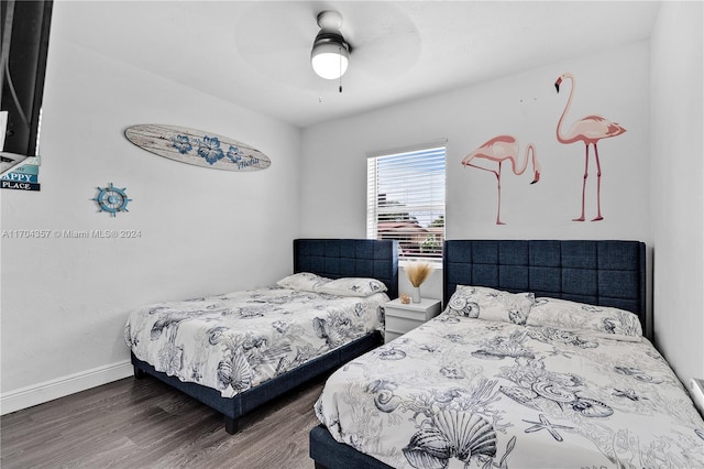 bedroom featuring dark hardwood / wood-style flooring and ceiling fan