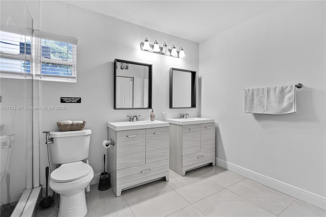 bathroom with tile patterned floors, vanity, and toilet