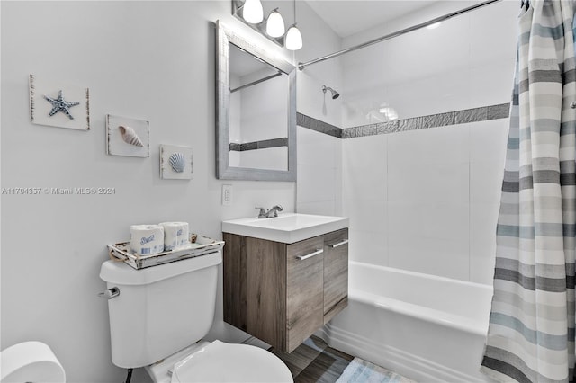 full bathroom featuring vanity, toilet, and shower / bath combo with shower curtain