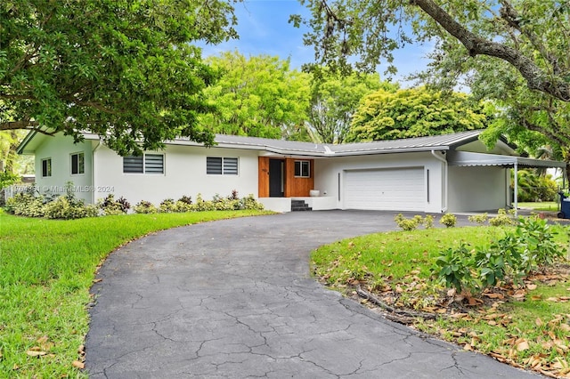 ranch-style house featuring a garage