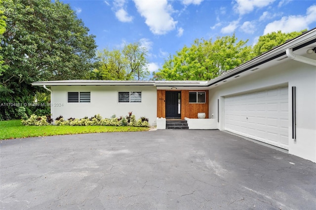 ranch-style house featuring a garage