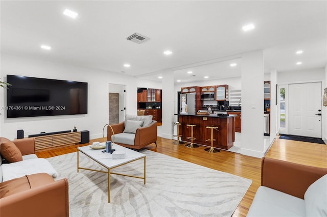 living room with light hardwood / wood-style floors