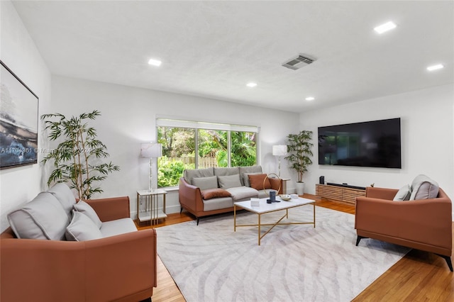 living room with light hardwood / wood-style floors