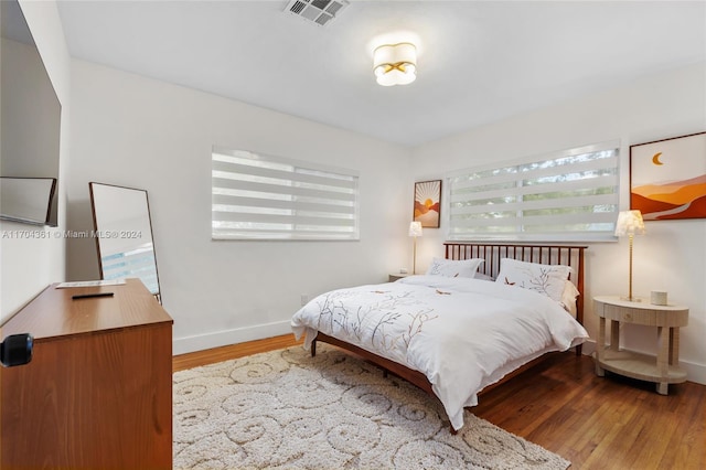 bedroom with hardwood / wood-style floors