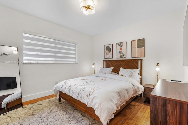 bedroom featuring wood-type flooring